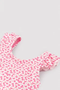 Bañador bebé niña detalles volantes estampado flores rosa