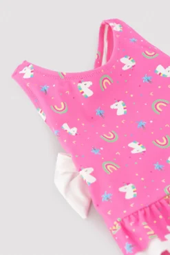 Bañador bebé niña detalles volantes y lazos estampado unicornios rosa