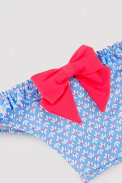 Bañador culetín bebé detalles volantes y lazos estampado flores azul