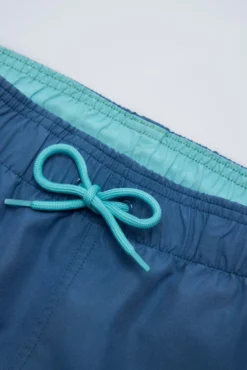 Bañador juvenil corto estampado liso azul
