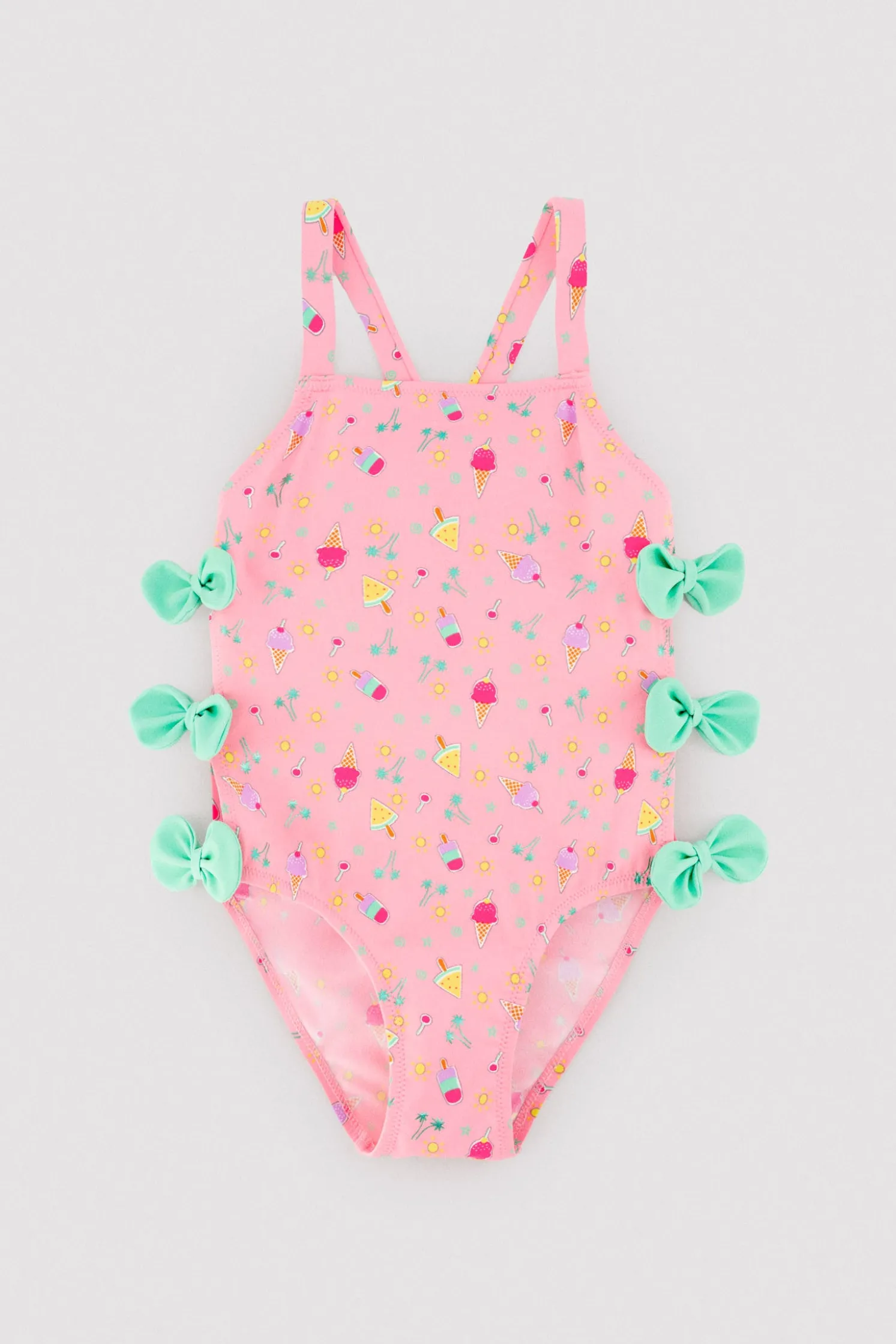 Bañador niña detalle cut-out y lazos estampado veraniego rosa