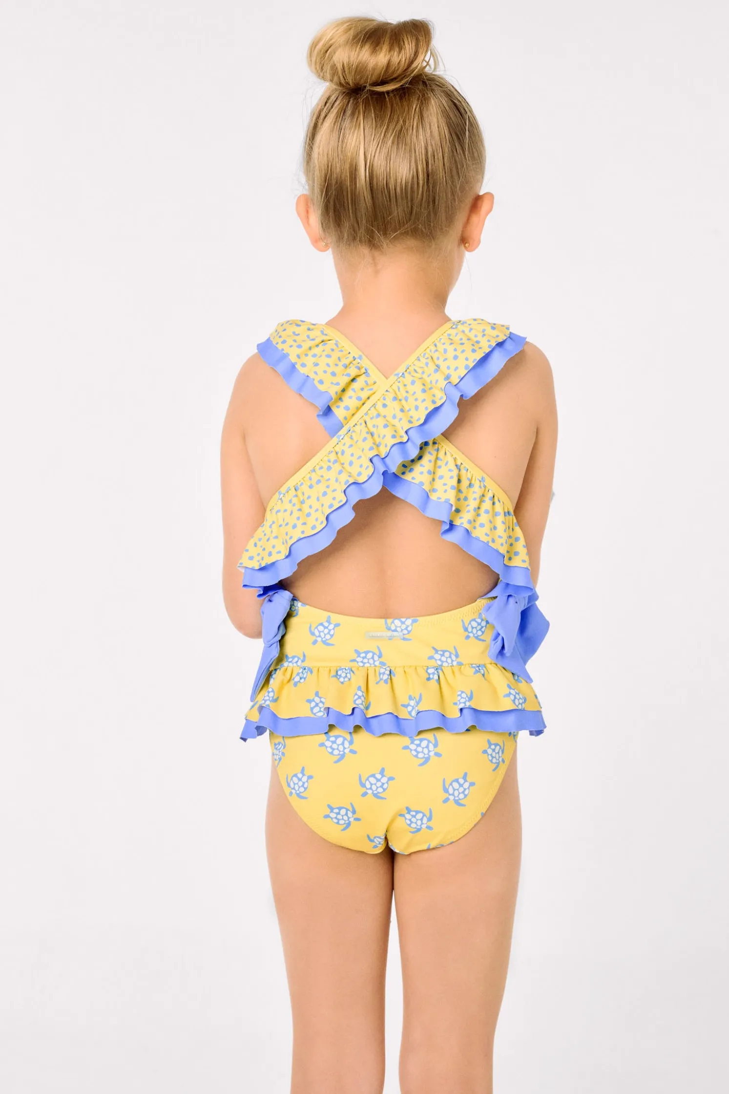 Bañador niña detalles volantes y lazos estampado tortugas amarillo