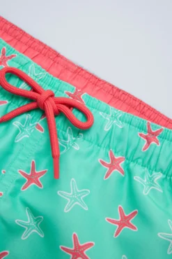 Bañador niño corto estampado estrellas marinas turquesa
