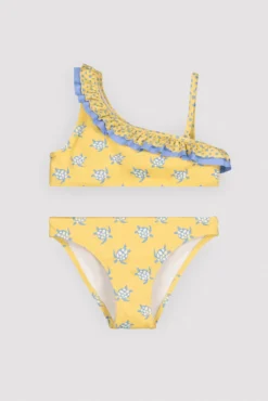 Bikini niña asimétrico detalle volantes estampado tortugas amarillo