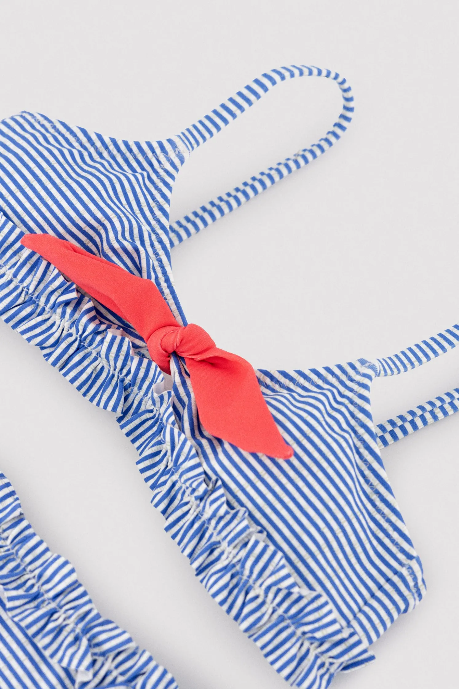 Bikini niña detalle lazo y fruncidos estampado rayas