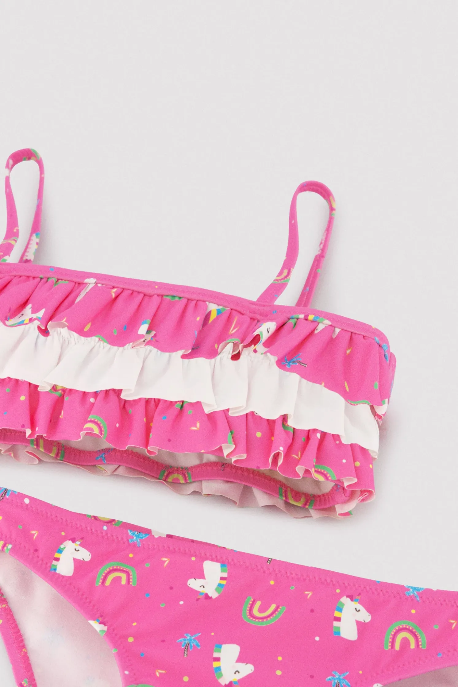 Bikini niña detalle volantes estampado unicornios rosa