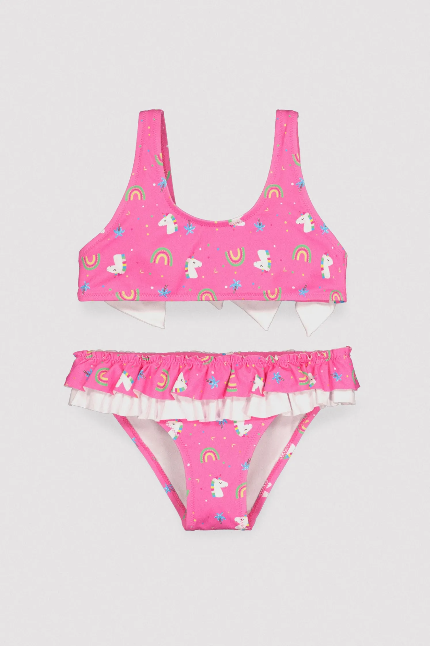 Bikini niña detalle volantes y lazos estampado unicornios rosa