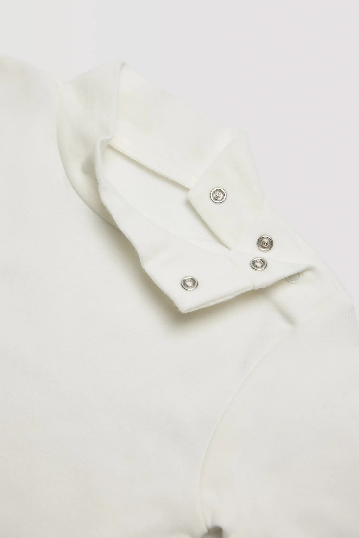Body bebé básico cuello alto blanco