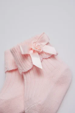 Calcetines canalé con lazo recién nacido rosa