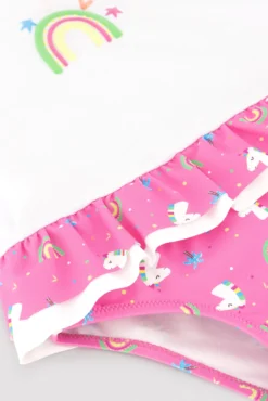 Conjunto bebé camiseta y braguita baño detalles volantes y lazos estampado unicornios rosa