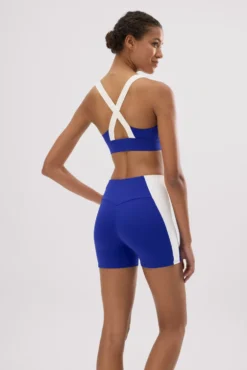Leggings deportivos cortos efecto push-up azul índigo con franja en contraste