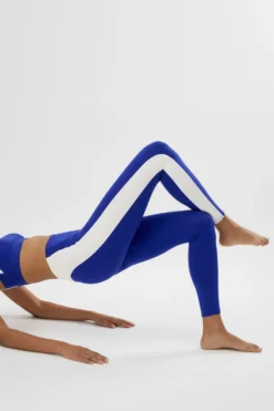 Leggings deportivos largos efecto push-up azul con franja en contraste