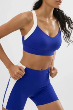 Sujetador deportivo contorno ajustable blanco y azul eléctrico