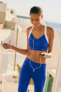 Sujetador deportivo contorno ajustable blanco y azul eléctrico